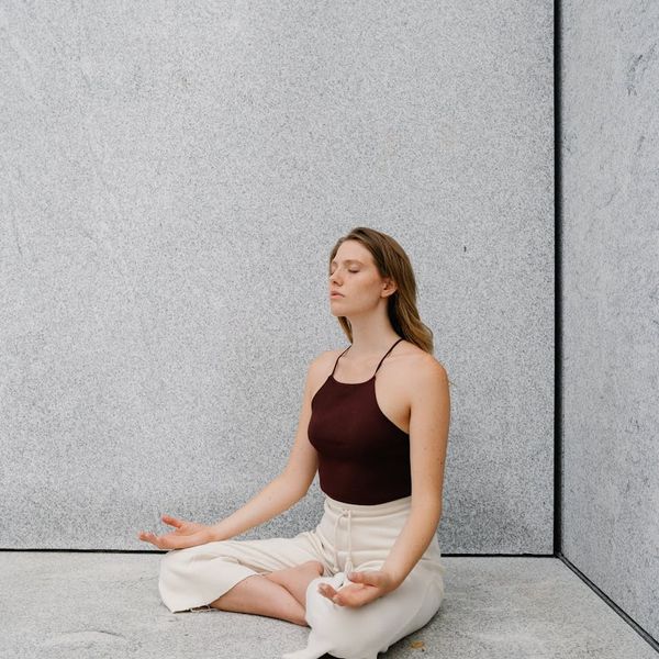 Person practicing a balancing pose, symbolizing strength and mental clarity.